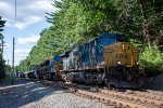 CSX 484 roars around the bend at Burnham Road with M427 in Tow